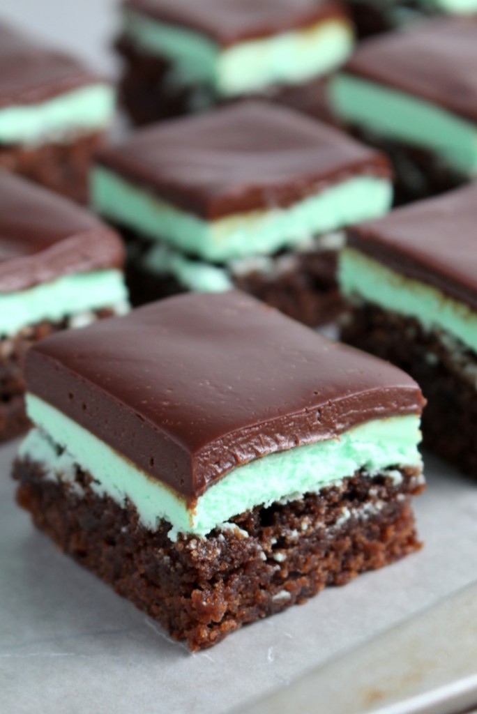 A fudgy mint brownie spread with a fluffy, mint buttercream and a rich, smooth chocolate ganache.