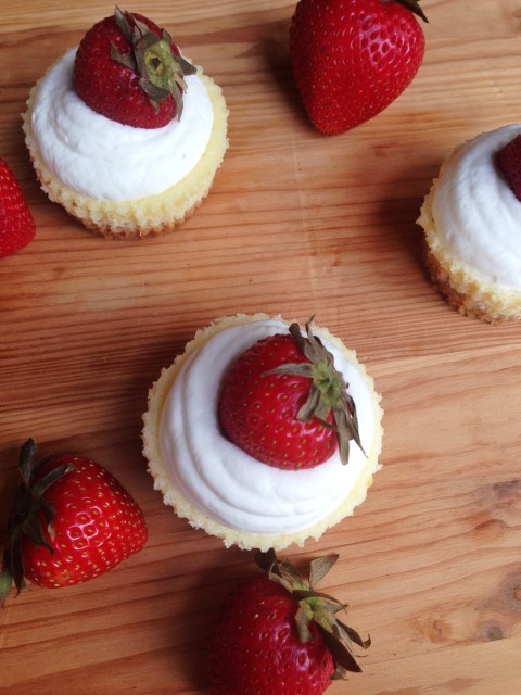 The lightest, fluffiest lemon cheesecake you will ever have. Topped with whip cream and a strawberry. - Chocolate with Grace