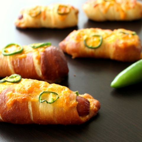 Jalapeno Popper Pretzel Dogs. A hot dog wrapped in soft, chewy pretzel dough stuffed with cheese and jalapenos.