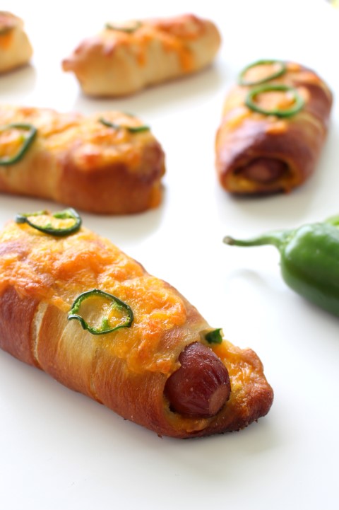 Jalapeno Popper Pretzel Dogs. A hot dog wrapped in soft, chewy pretzel dough stuffed with cheese and jalapenos.