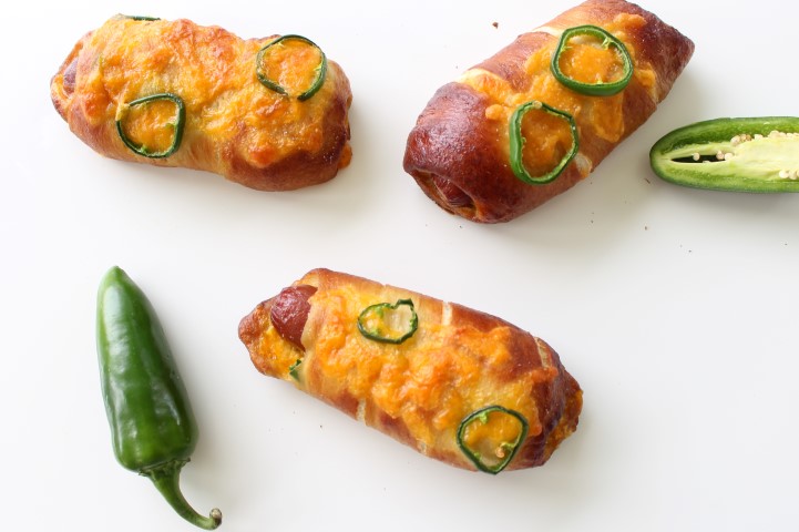 Jalapeno Popper Pretzel Dogs. A hot dog wrapped in soft, chewy pretzel dough stuffed with cheese and jalapenos.