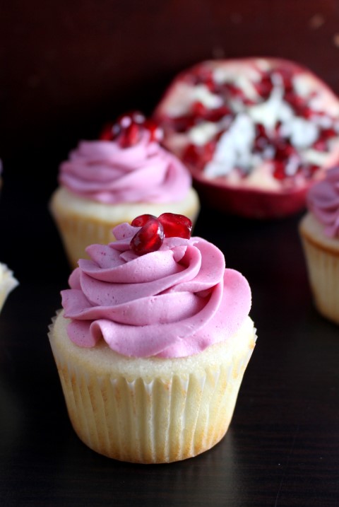 The best white cupcake with tangy, creamy pomegranate buttercream makes these cupcakes perfect for a special occasion.