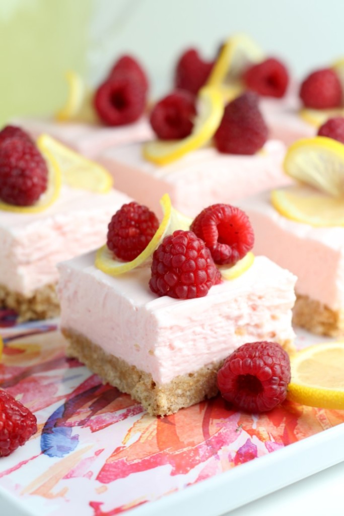 These Raspberry Lemon No Bake Cheesecake Bars require just 4 ingredients for the cheesecake layer that is chilled on a simple graham cracker crust. #PourMoreFun #ad