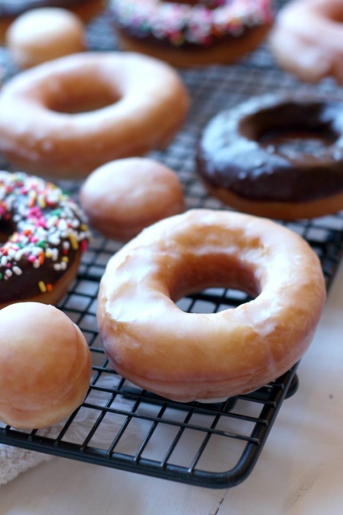 Homemade Fried Yeast Donuts with Vanilla or chocolate glaze and sprinkles of course. Because sprinkle donuts are the best!