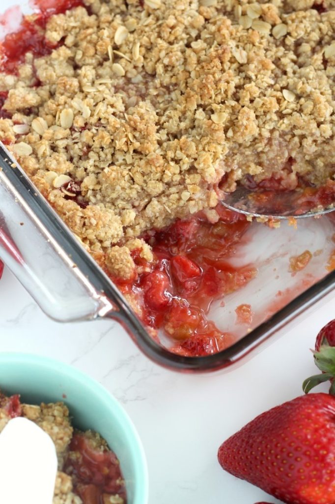 Strawberry Rhubarb Crisp is a quick and easy springtime dessert that is perfect for last minute guests. Fresh rhubarb and sweet strawberries topped with a crunchy oatmeal crumble make a dessert no one will forget. Top with whipped cream or vanilla ice cream.