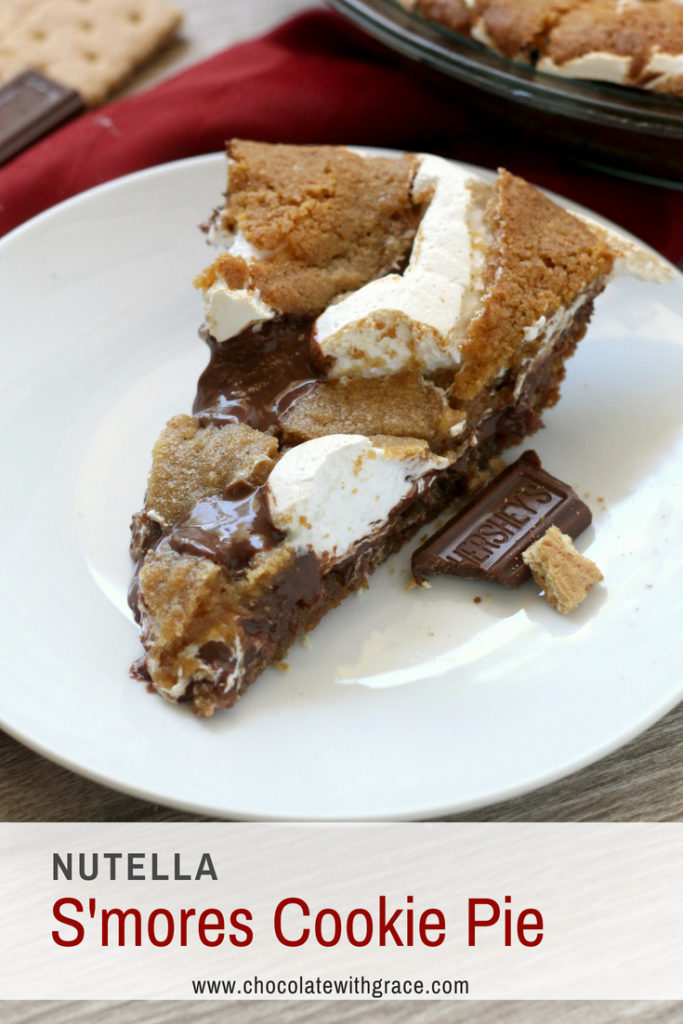Nutella Smores Cookie Pie. An fun indulgent s'mores dessert. Everyone will love the warm graham cracker cookie, sticky marshmallow and rich hazelnut chocolate layer. Be sure to have friends around to help you eat it.