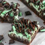 Mint Oreo Brownies with thick frosting and a fudge drizzle