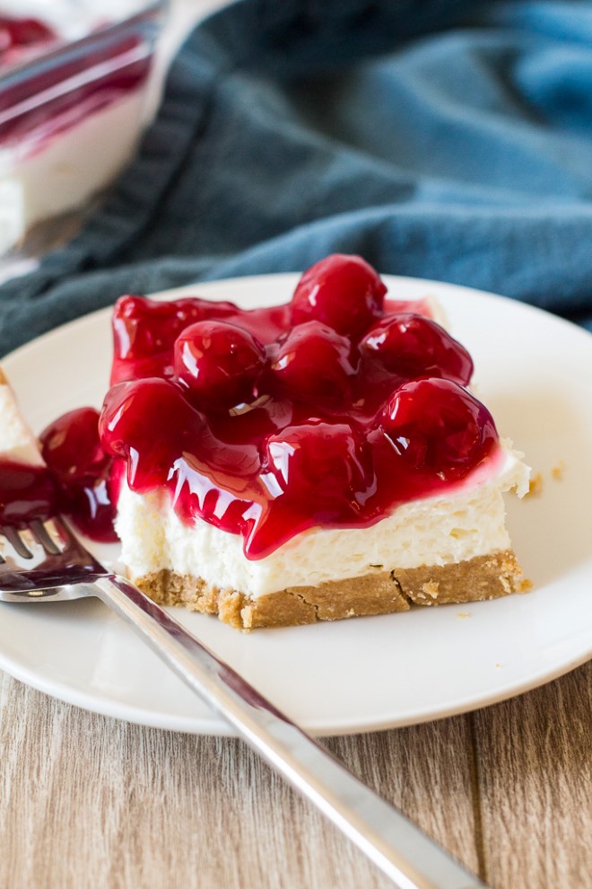 piece of no bake cherry cheesecake on a plate