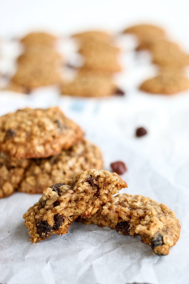 Oatmeal cookies with raisins baked on parchment paper.