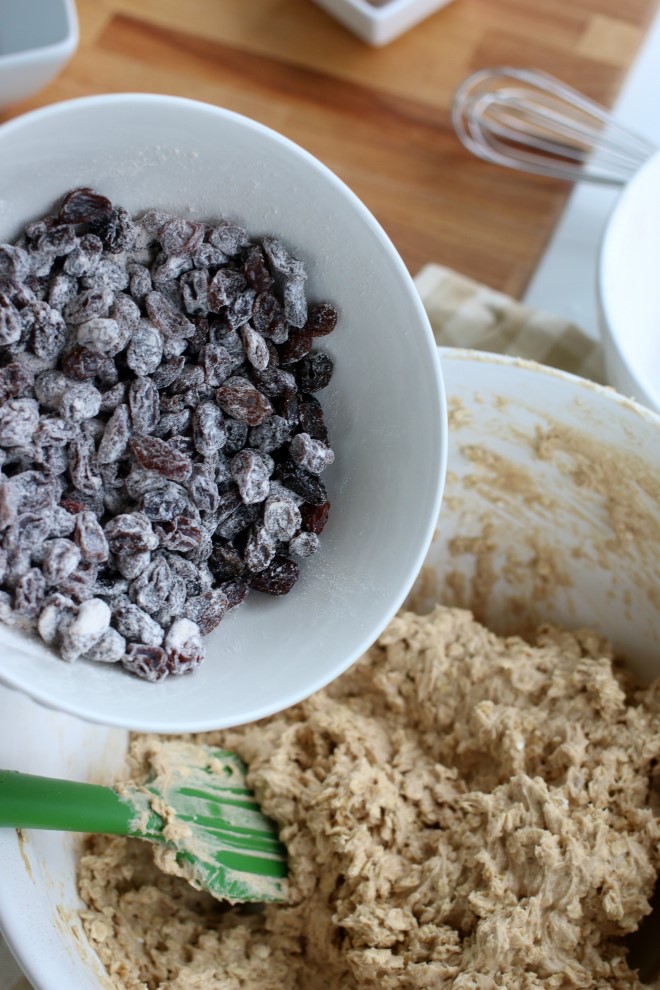 Adding flour coated raisins the an oatmeal cookies recipe.