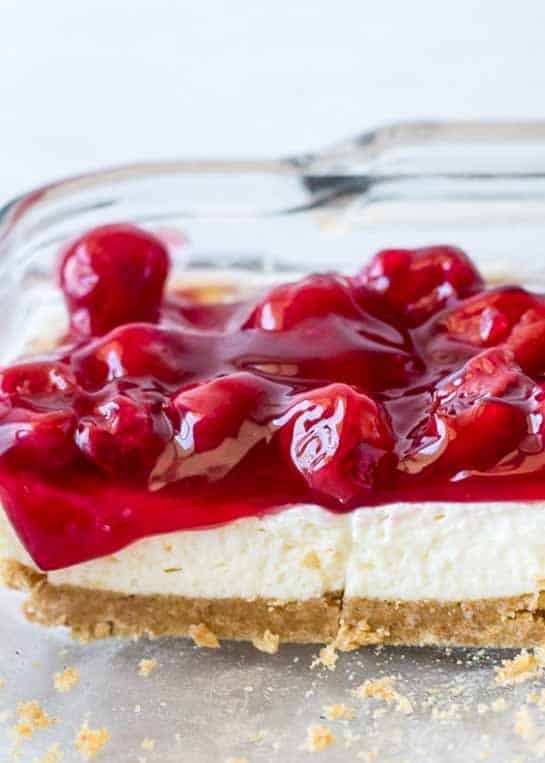 photo of sliced no bake cheesecake in serving pan