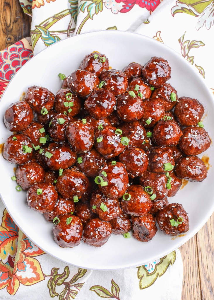 Sticky Meatballs in white round bowl with napkin