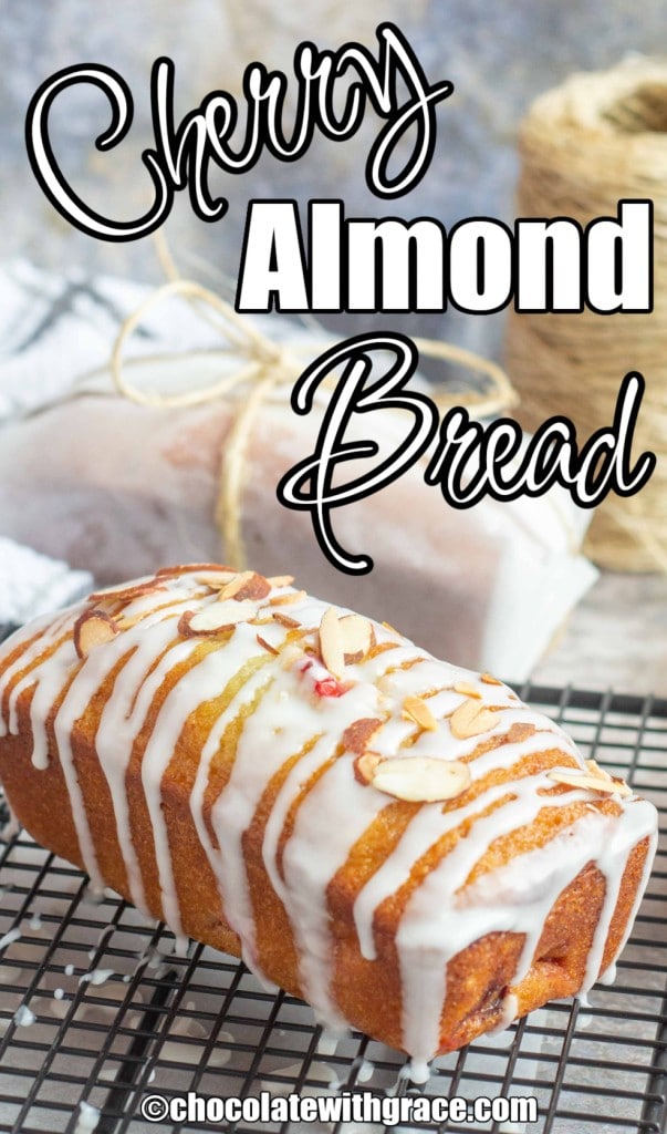 white lettering has been overlaid this photo of a glazed loaf of sweet bread topped with sliced almonds on a wire rack. it reads: "Cherry Almond Bread"