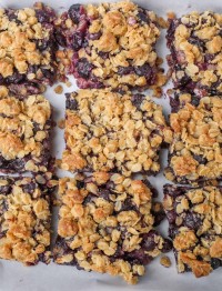 Blueberry Crunch Bars on parchment paper
