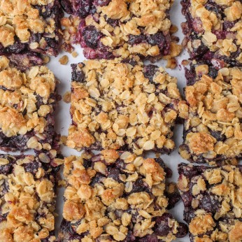 Blueberry Crunch Bars on parchment paper