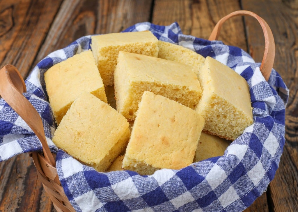 Cornbread squares in basket with blue napkin