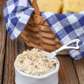 pecan butter in small white dish with cornbread in basket