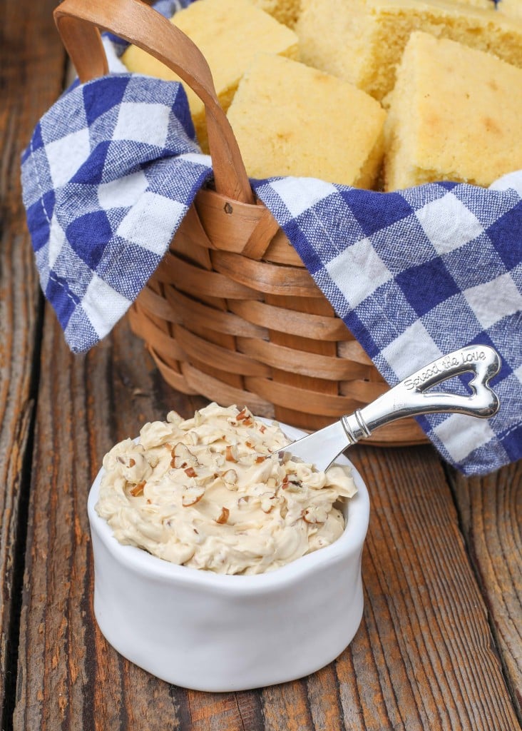 pecan butter in small white dish with cornbread in basket