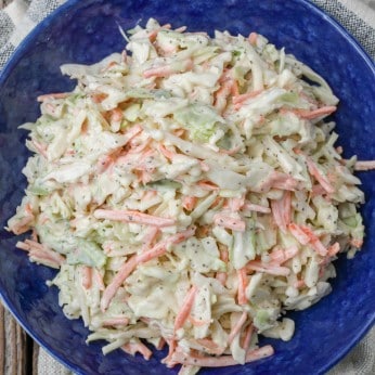 blue bowl with coleslaw on plaid towel