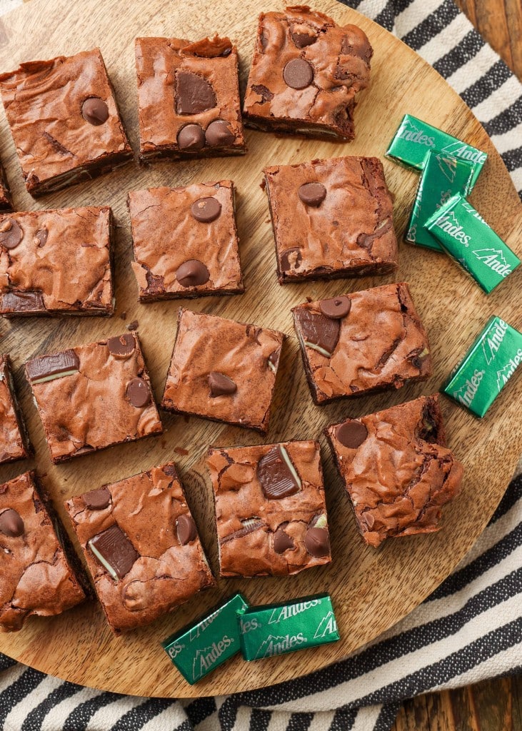 Andes Mints on cutting board with brownies