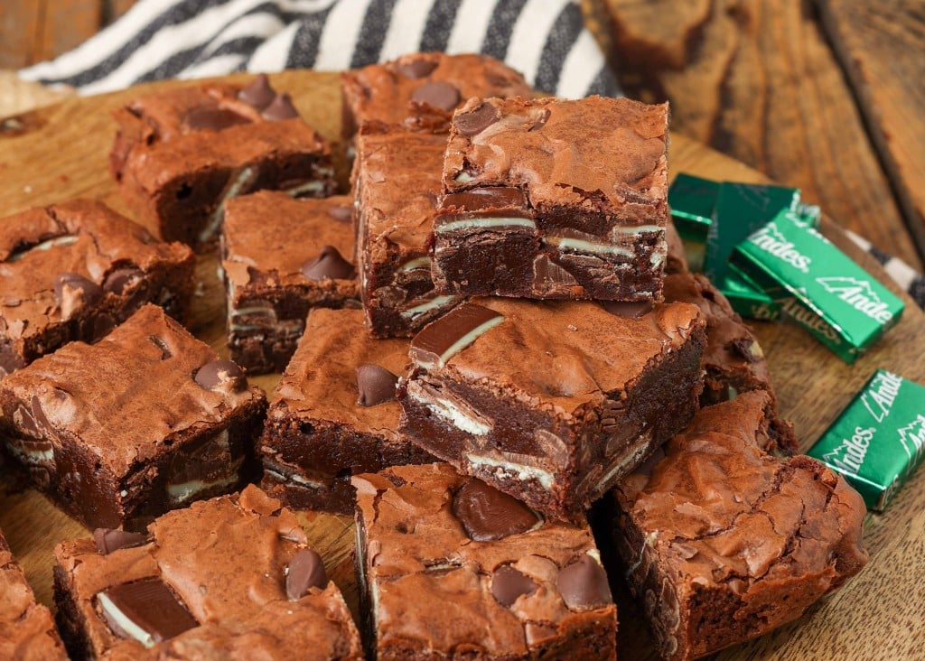 brownies stacked on cutting board with Andes mints