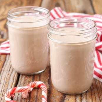 homemade coffee creamer in small jars with candy cane
