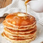 stacked pancakes with butter and syrup