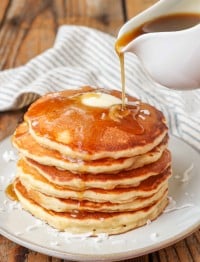 stacked pancakes with butter and syrup