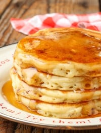 Sausage Pancakes with syrup stacked on plate