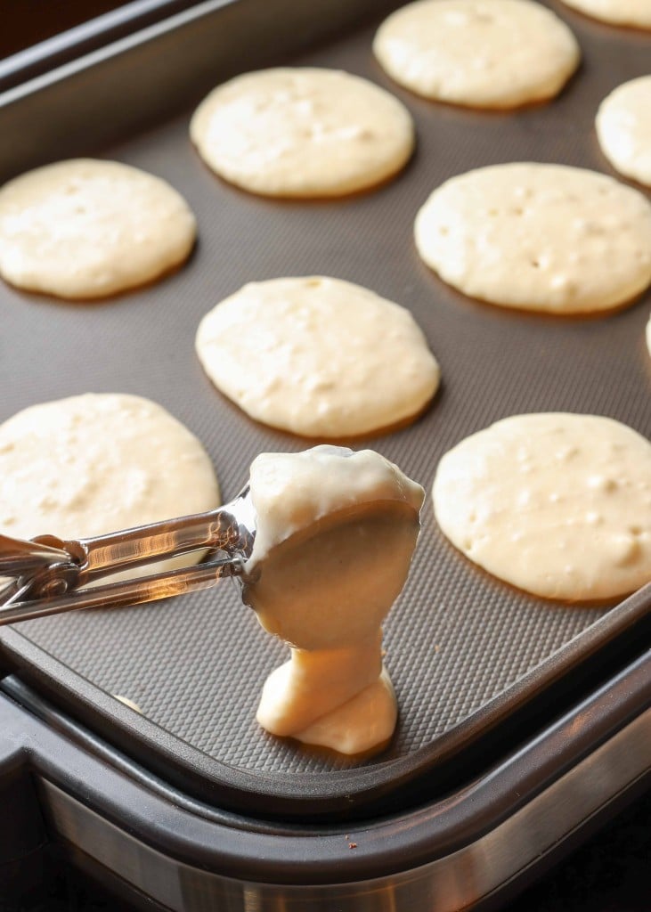 use a scoop to measure perfect silver dollar pancakes