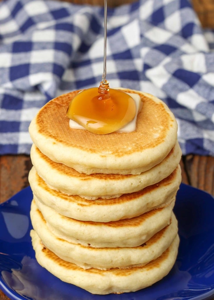 stacked silver dollar pancakes with butter and syrup
