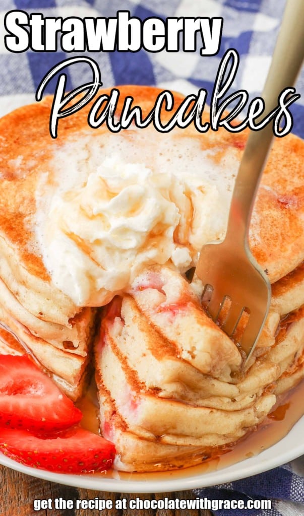 Strawberry Pancakes with whipped cream and syrup