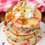Funfetti Pancakes with whipped cream and syrup
