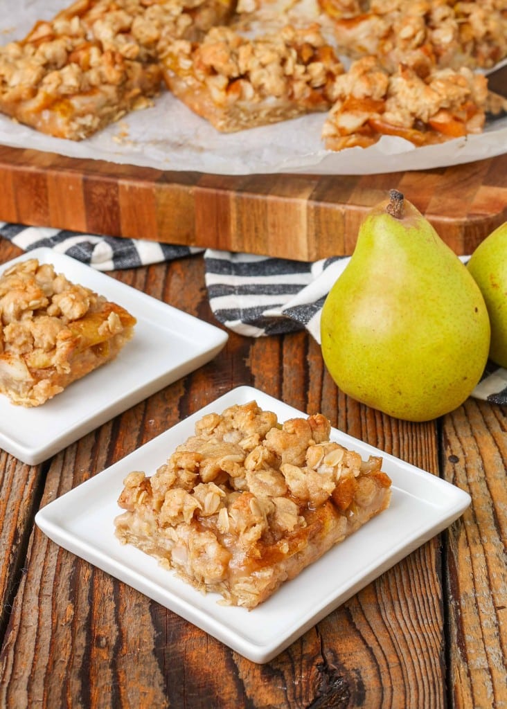 pear bars with oatmeal topping on square white plate