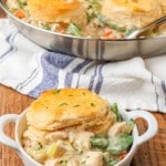 Chicken Pot Pie with Biscuits in white ramekin and pan