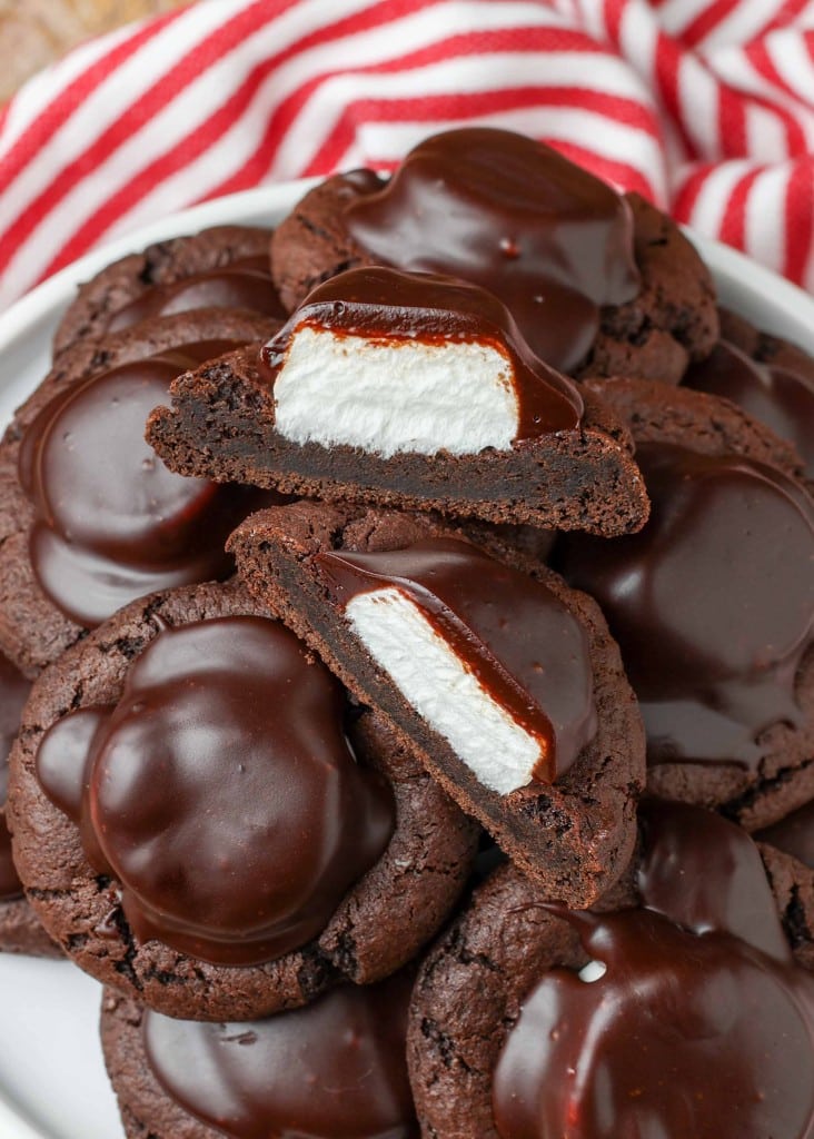 Chocolate Marshmallow Covered Cookies sliced in half with a red and white napkin