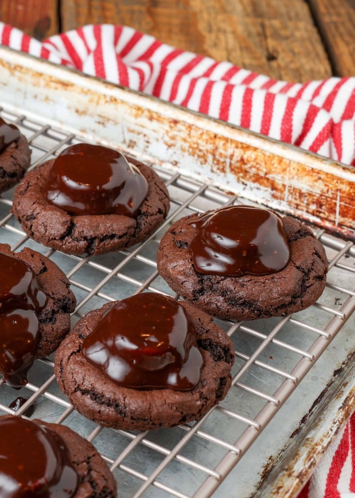 Chocolate Covered Marshmallow Cookies with warm fudge on cooling rack