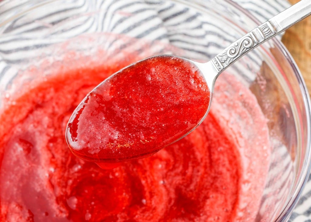 strained strawberry coulis in glass dish