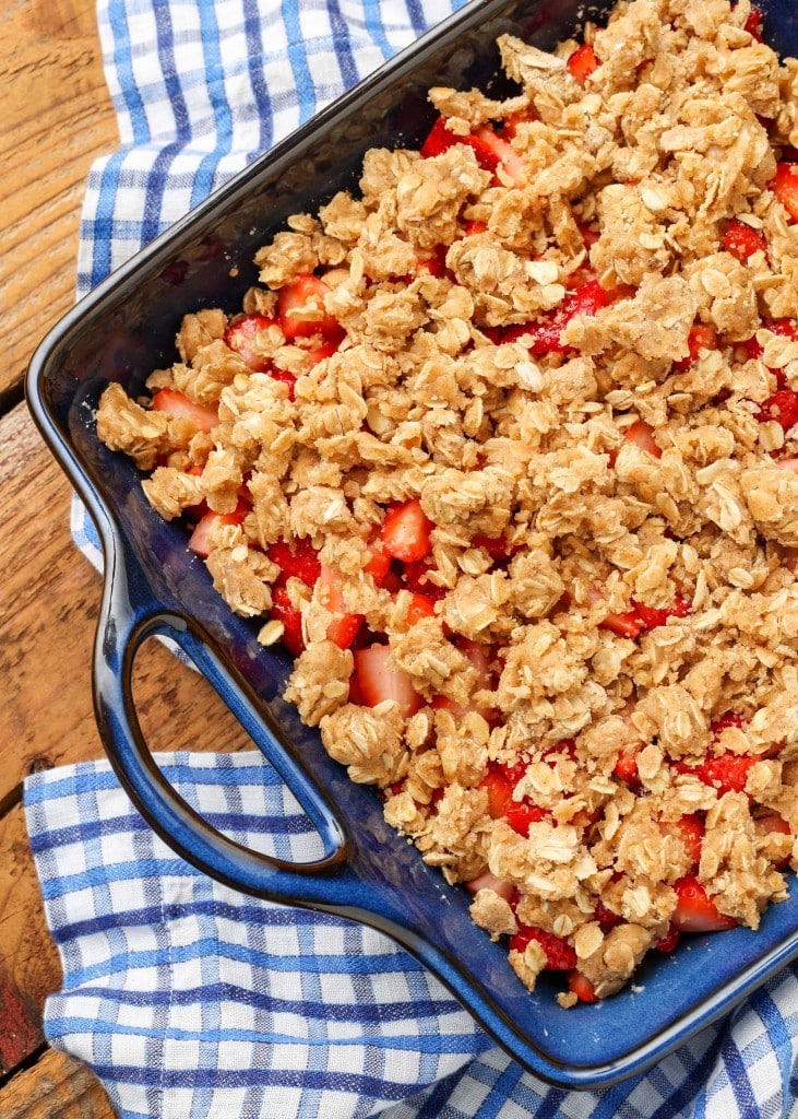 Strawberry Crisp in blue baking pan with blue and white checked linen