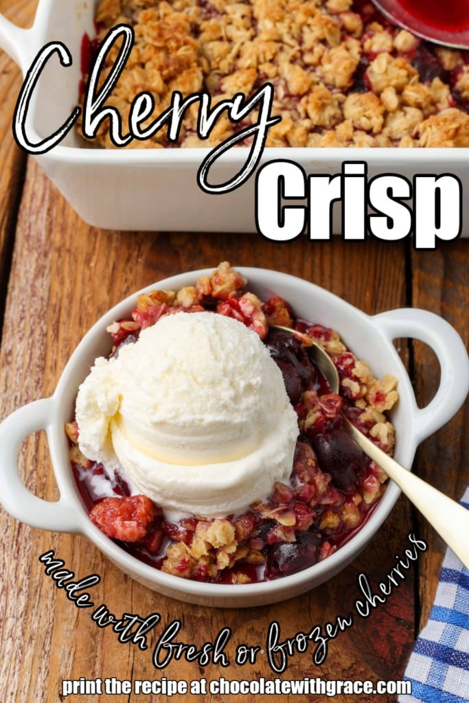 Dark red cherry and oatmeal crisp topped with white vanilla ice cream in white bowl with silver spoon