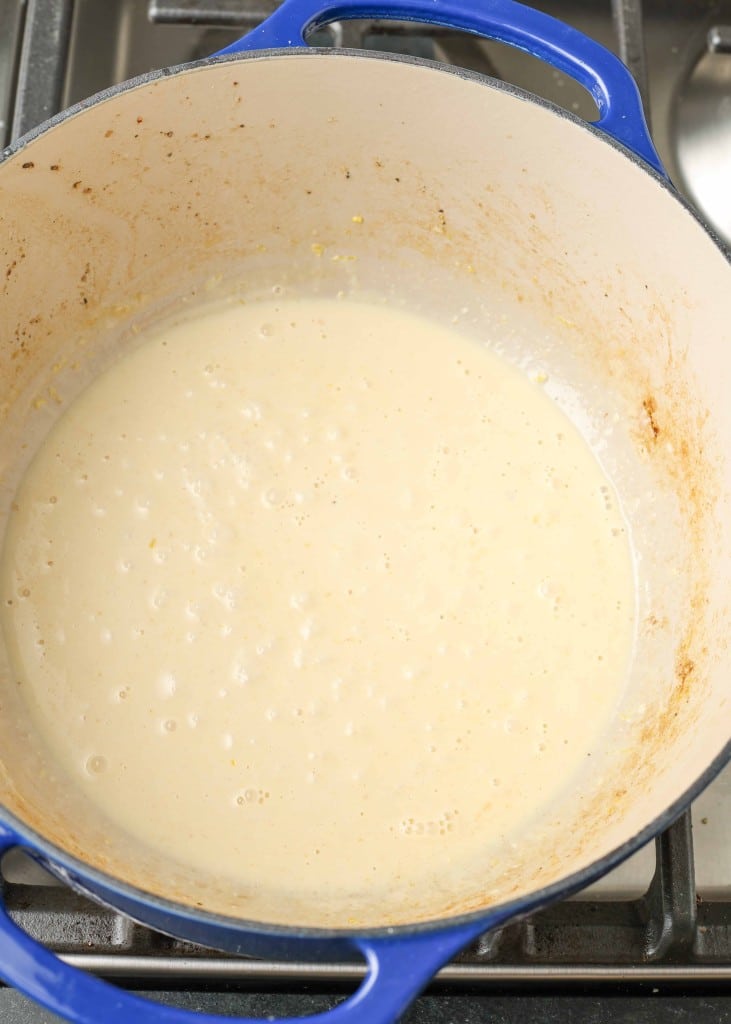 Overhead shot of finished butter sauce in blue pot