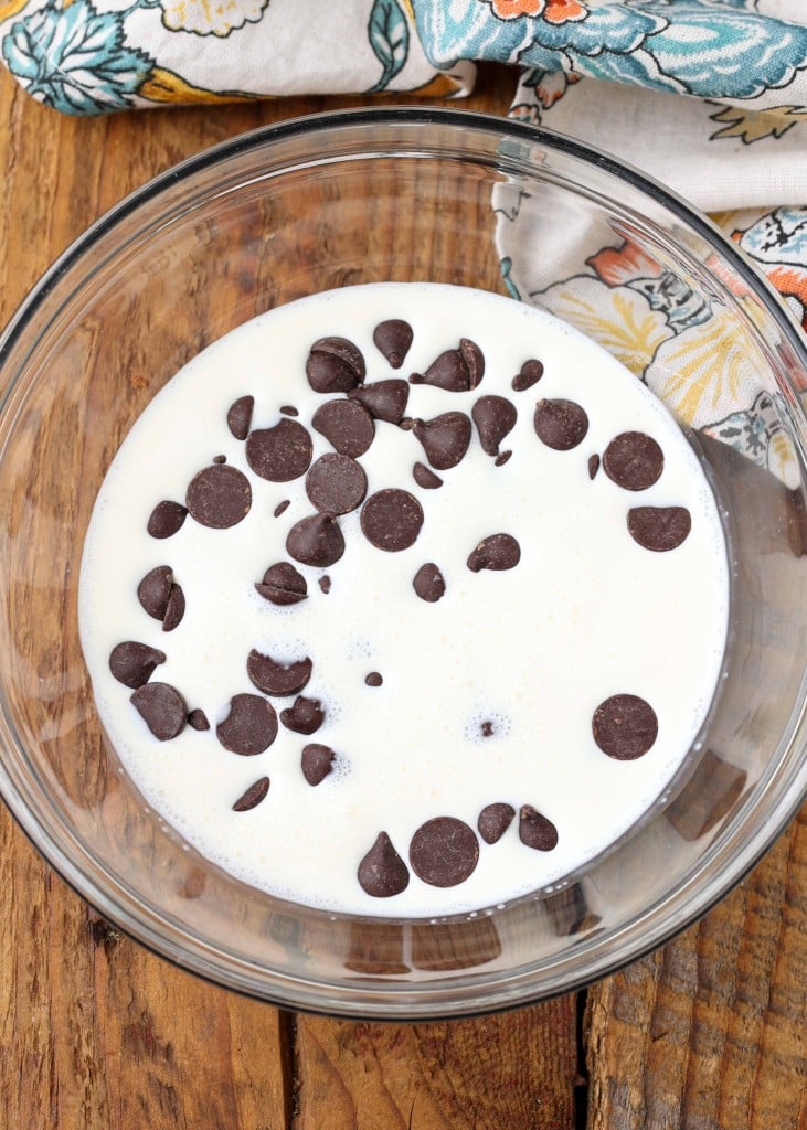 chocolate chips and cream in a small glass bowl