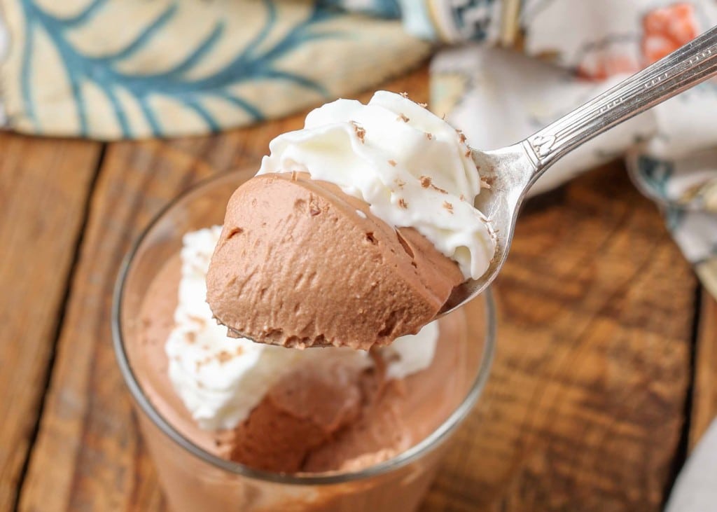 spoonful of mousse with whipped cream