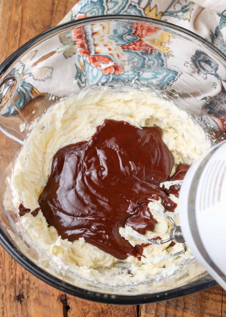 cream cheese with melted chocolate in mixing bowl