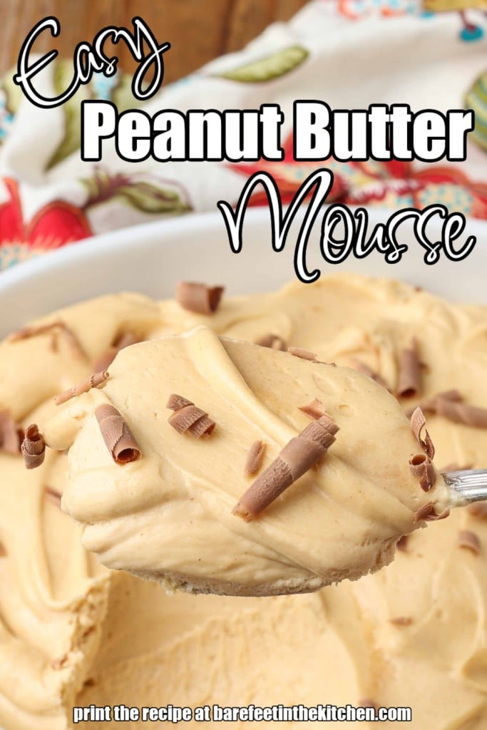 Wide shot of peanut butter mousse, served in a white bowl with a silver spoon