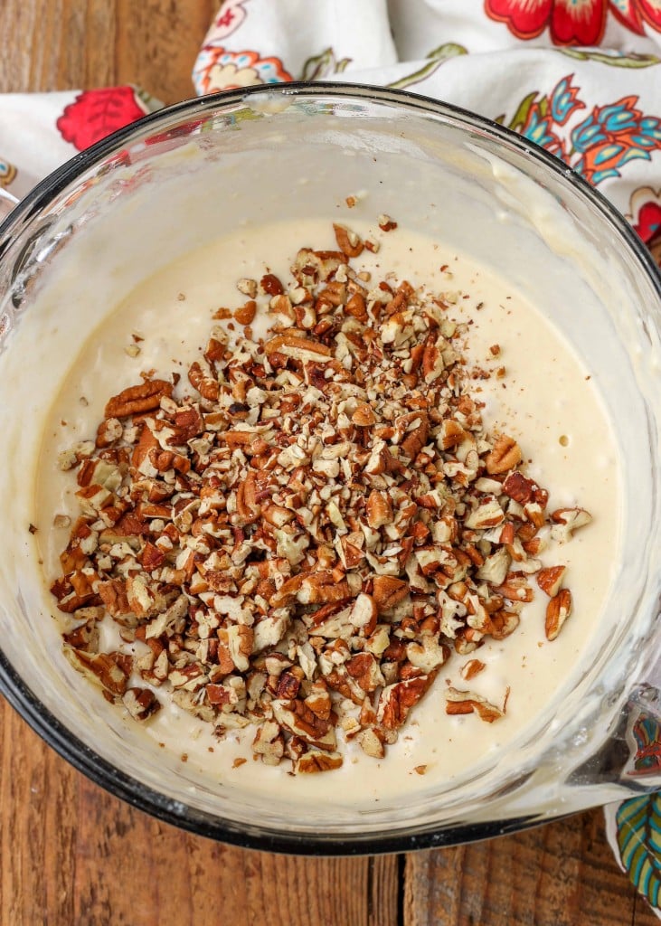 pecan pieces have been added to the pancake batter in a large mixing bowl