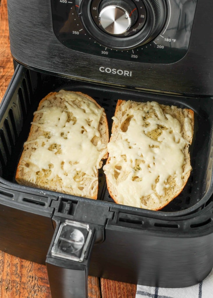 The french bread has been toasted with plenty of cheese and butter, fresh from the air fryer.