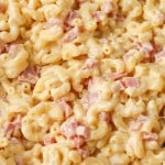 A close of photo of creamy mac and cheese with ham.