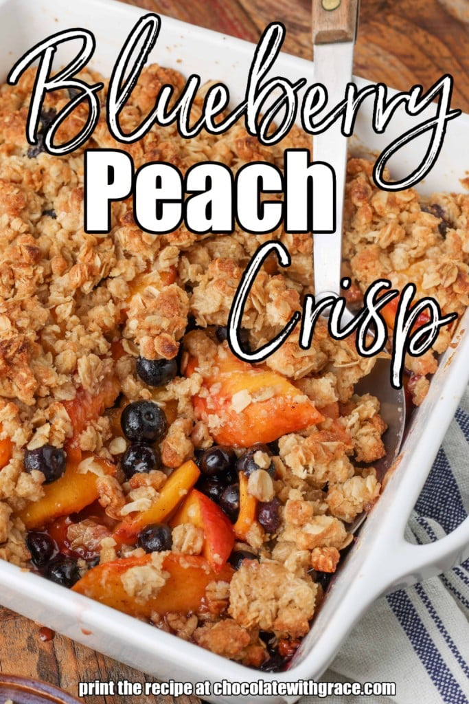 white lettering has been overlaid this image of a pan of fruity crisp with a metal serving spoon sticking out of it. it reads, "Blueberry Peach Crisp."