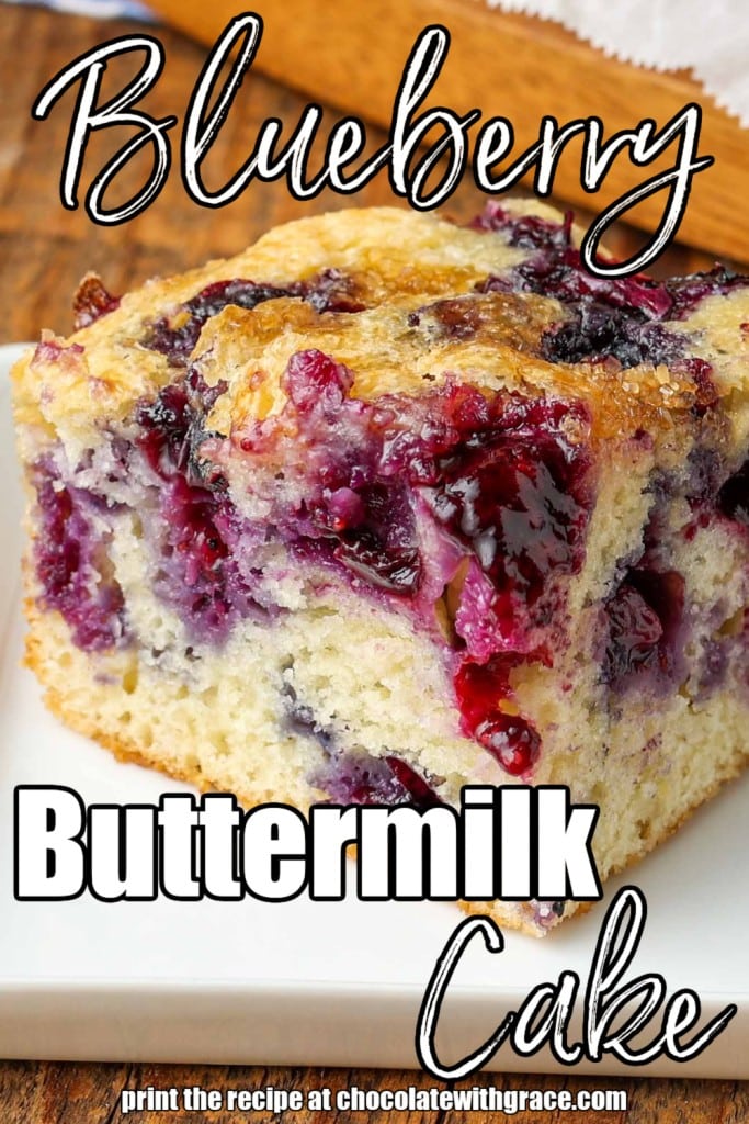 White lettering has been overlaid this close up image of a slice of blueberry buttermilk cake. It reads, "Blueberry Buttermilk Cake".